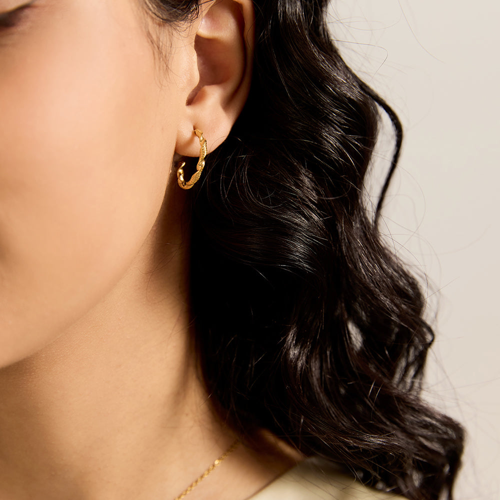 Model wearing Aveera designer silver-tone serpent and pearl drop earring, showcasing elegant everyday style.