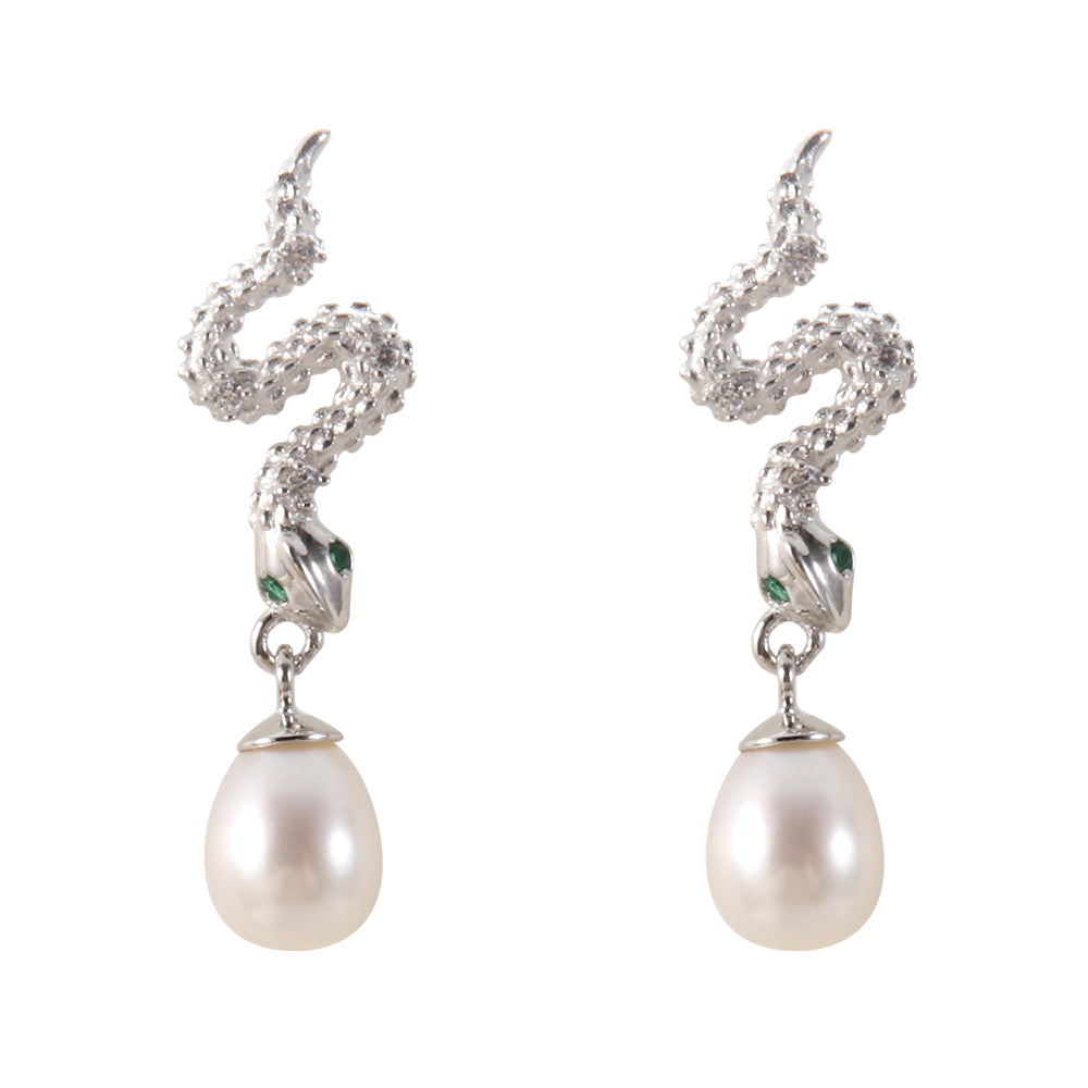 Close-up of Aveera serpent pearl earring showing intricate textured snake body, green gem eyes, and luminous pearl.