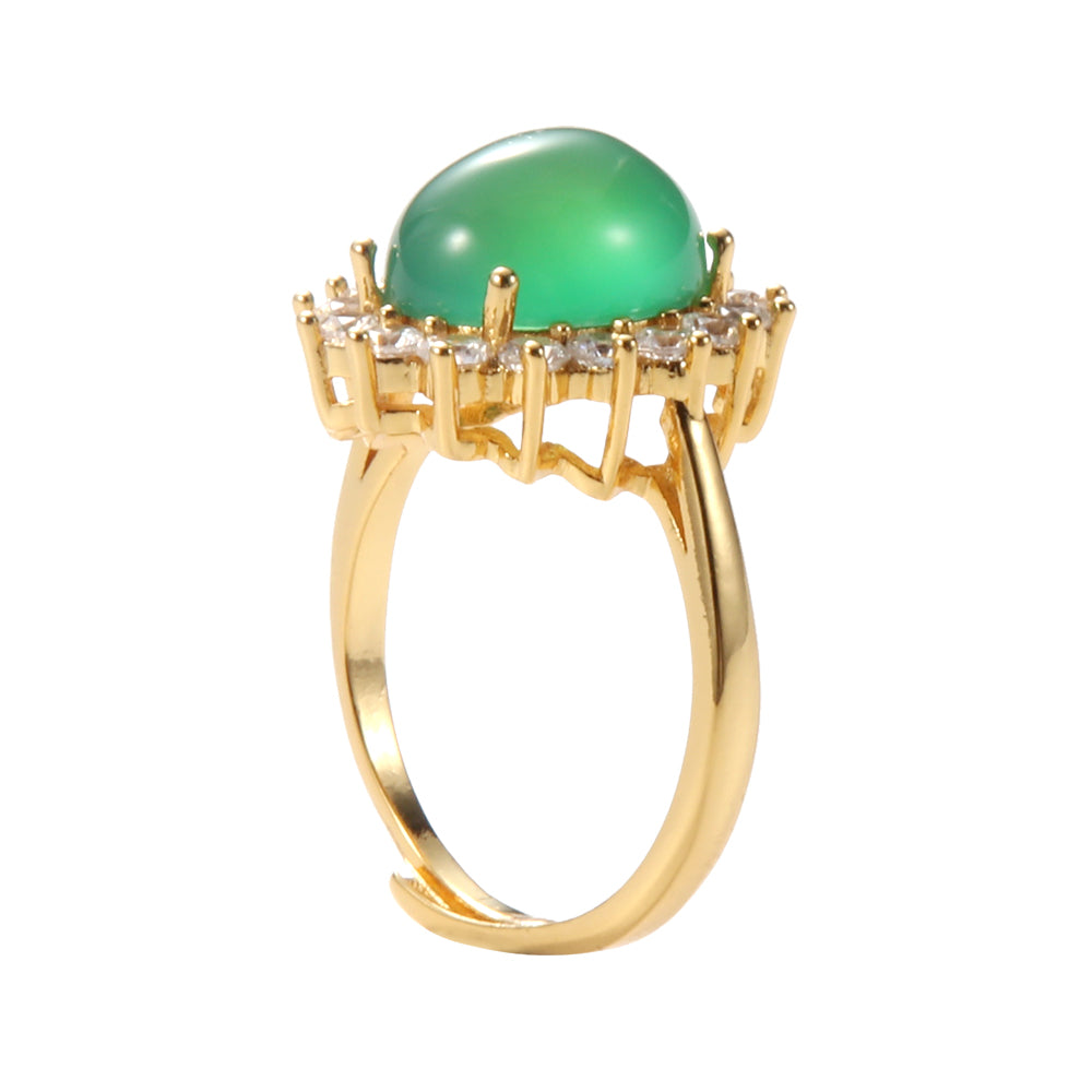 Aveera designer gold tone adjustable ring with large oval green gemstone and crystal halo, retro glam style.