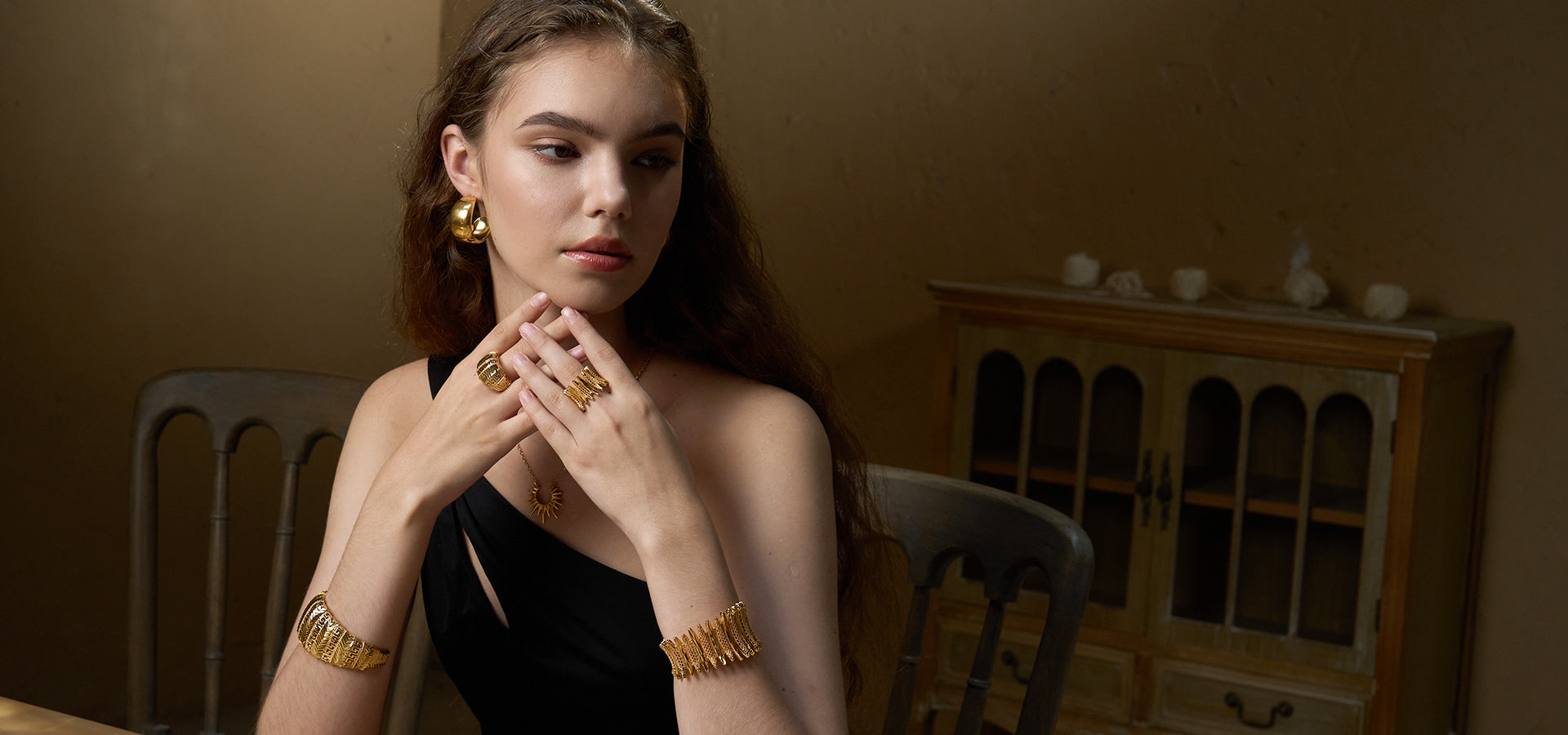 Models showcased a complete jewelry look with layered necklaces, rings, and bracelets from Aveera Jewelry.