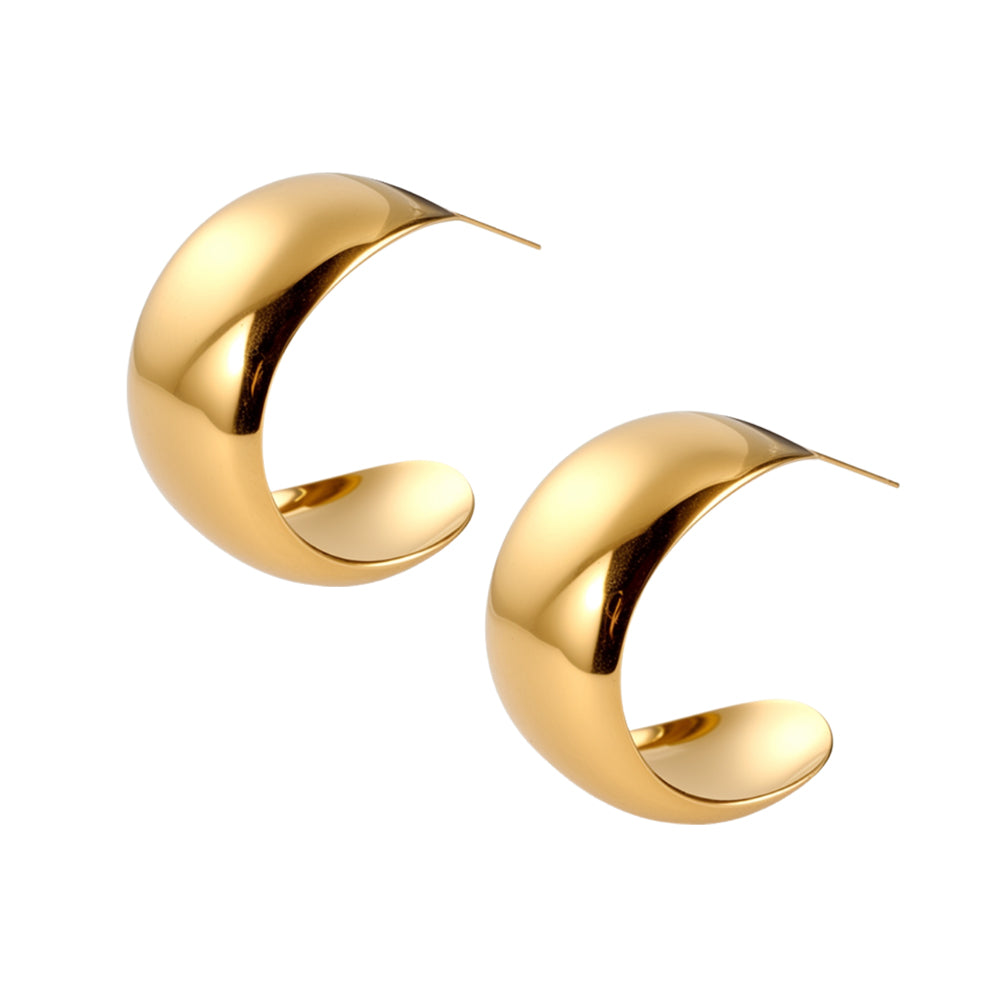 Pair of bold gold chunky dome hoop earrings on white background.