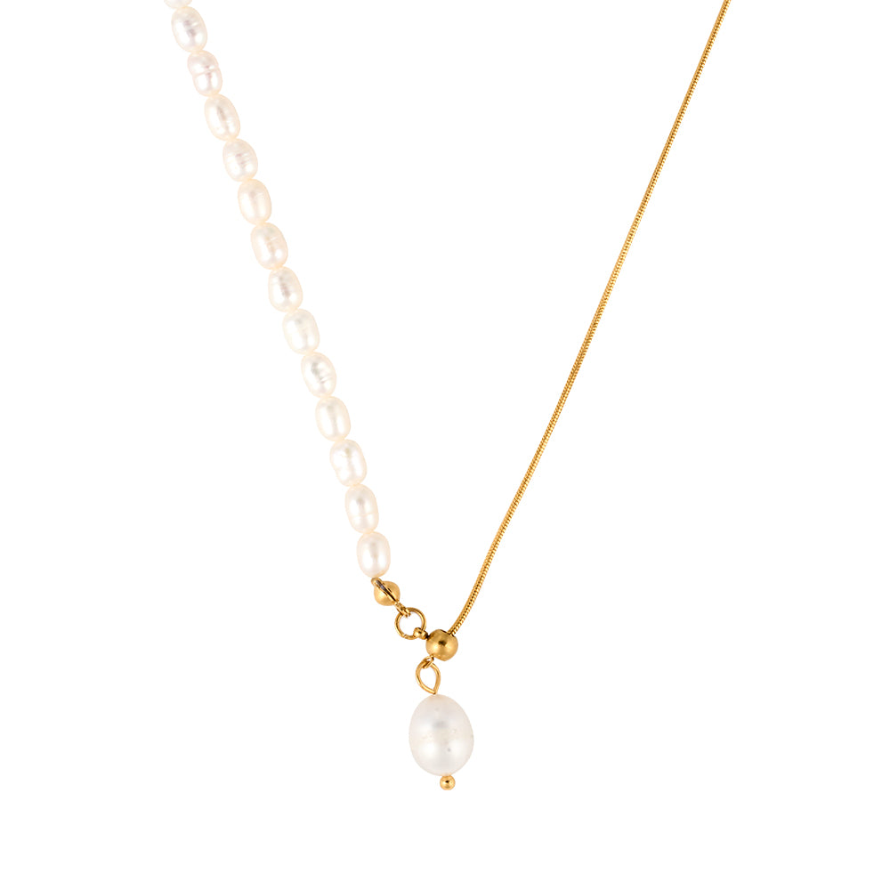 Unique gold tone necklace featuring a half pearl strand and half gold chain lariat design with a dangling pearl, symbolizing balance and flow.