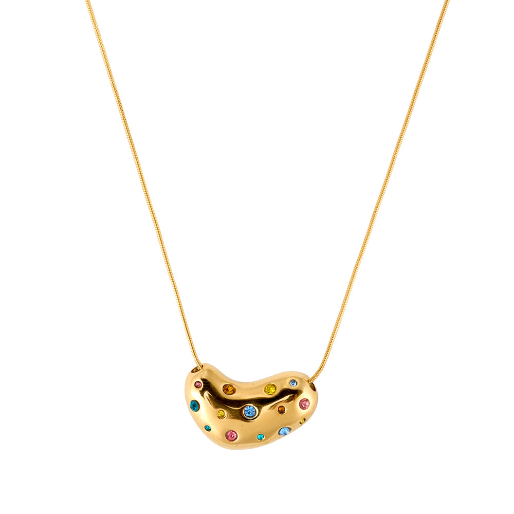 Gold tone bean-shaped pendant necklace with vibrant multi-color crystals, flat lay on a white background.