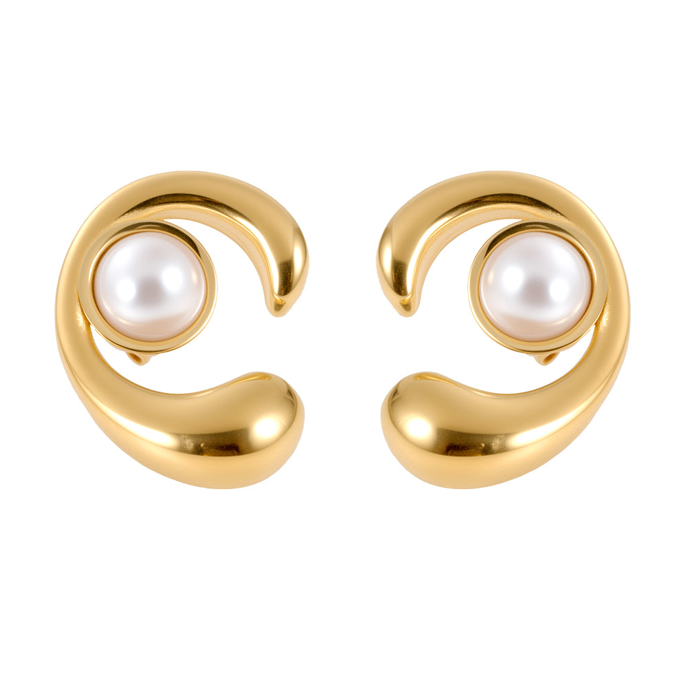 Side profile of woman wearing gold tone sculptural pearl stud earrings, showing fit and style.