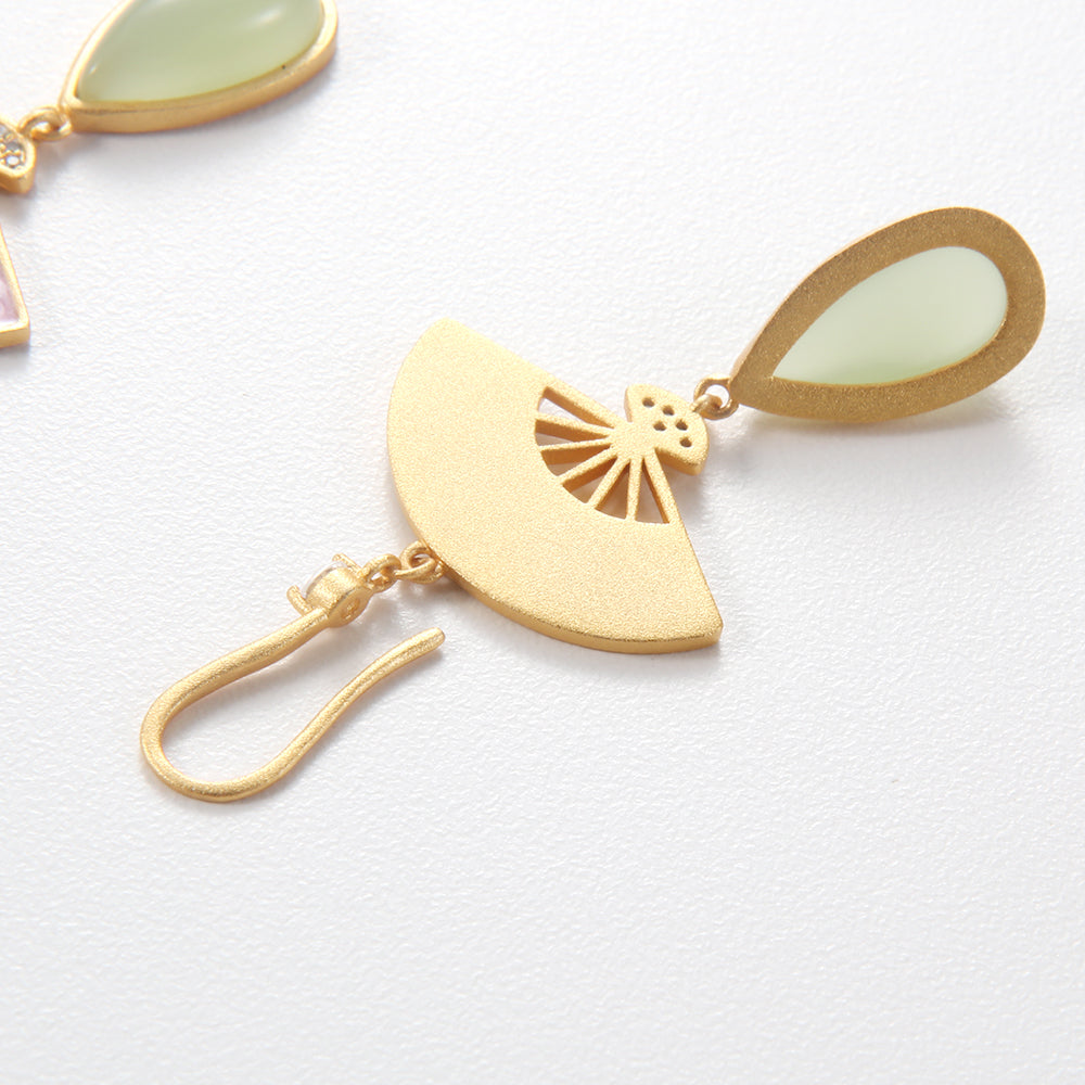 Back view of gold tone enamel fan and bamboo drop earring, showing the hook and gemstone setting.
