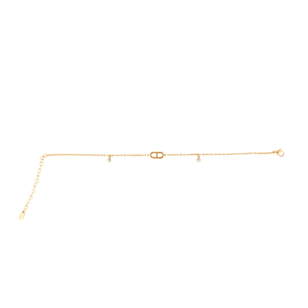 Elegant gold tone chain bracelet with a central oval CZ charm and two smaller dangling CZ stones.