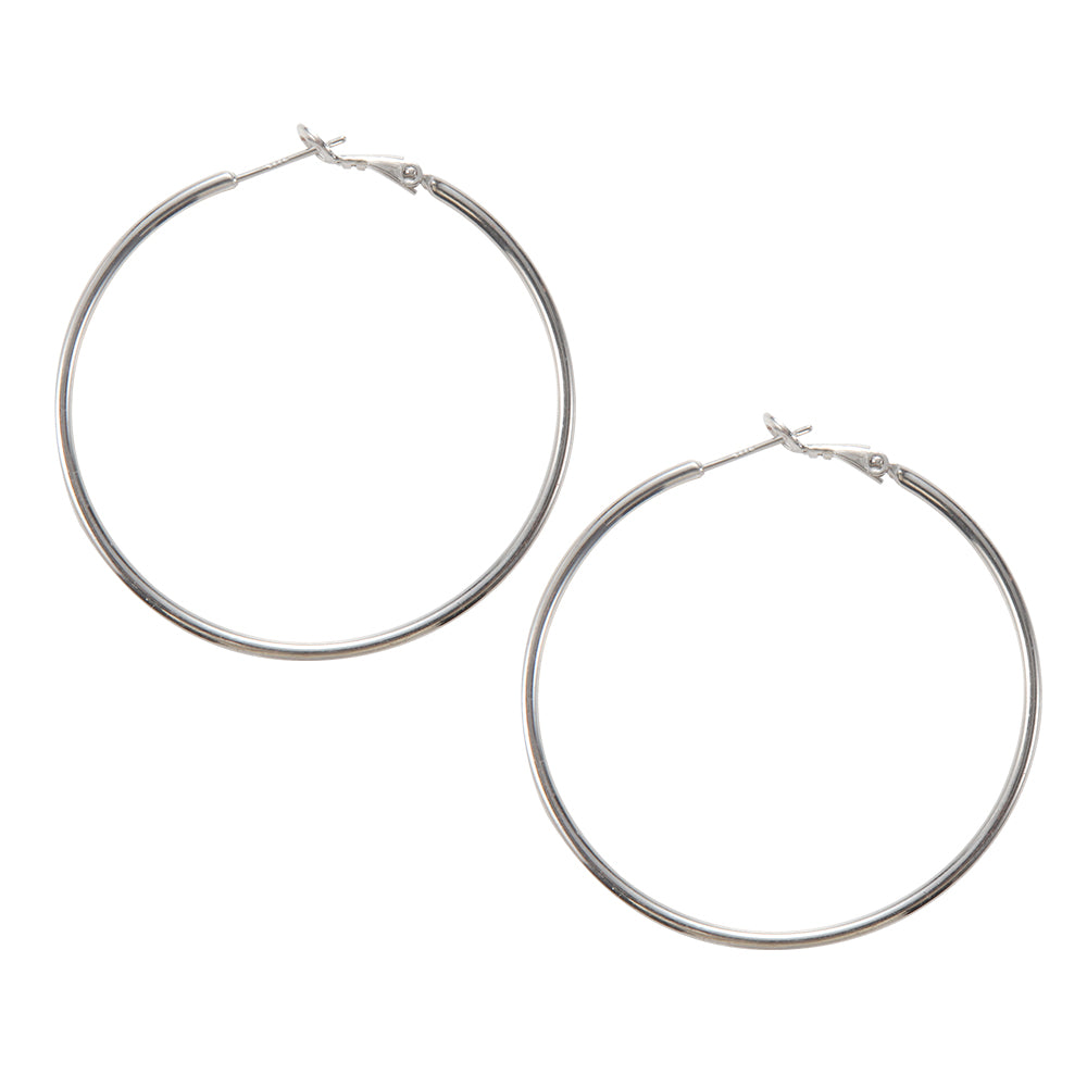Close-up of silver tone large classic hoop earrings, showing closure and smooth finish.