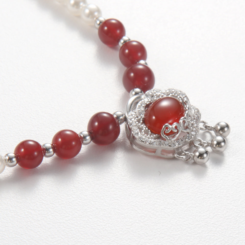 Close-up of the lustrous white pearls on the elegant beaded necklace.