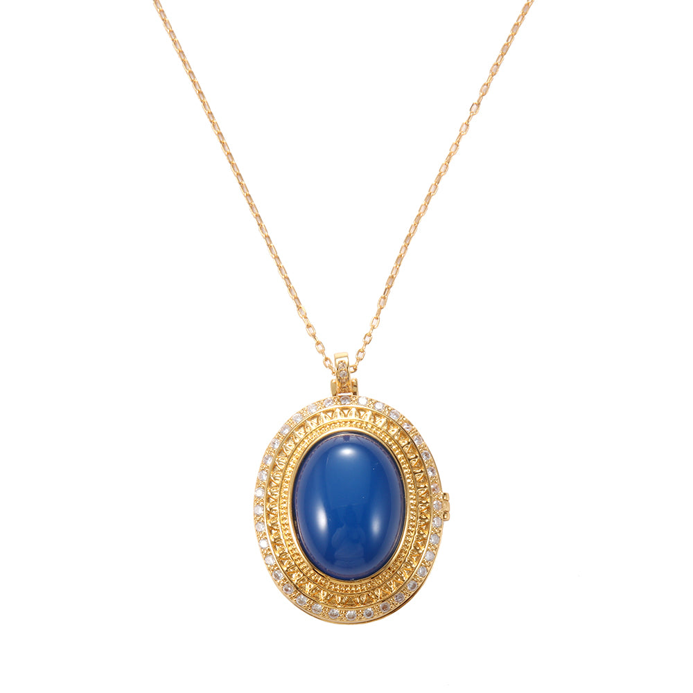 Spiritual gold tone oval blue gemstone amulet necklace, symbolizing wisdom, calm, and protection.