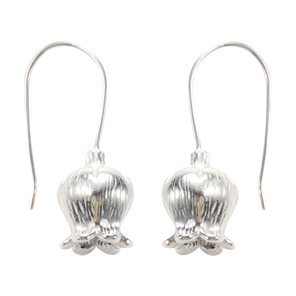 Close-up detail of sterling silver round pearlized stud earring showing intricate carving.